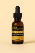 2 oz amber glass dropper bottle of The Noble Naturals® Hair Growth Oil displayed in a clean, natural product shot